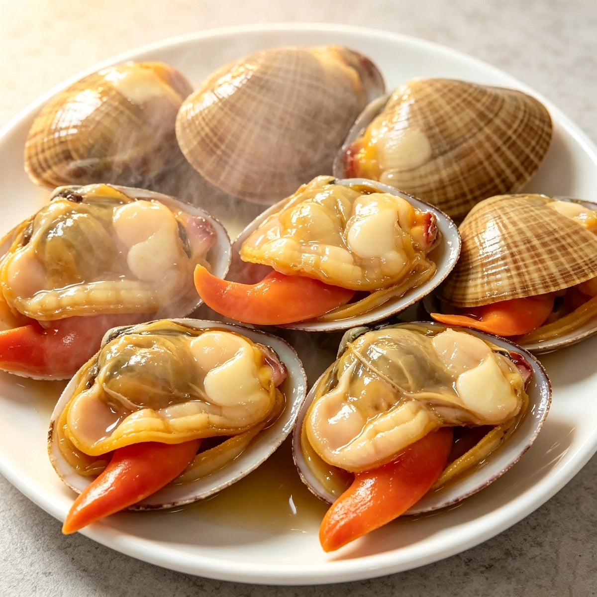 A plate of opened clams showing their plump meat and orange foot